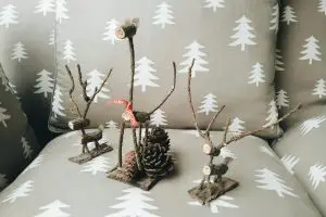 Christmas decorations made out of branches and pine cones